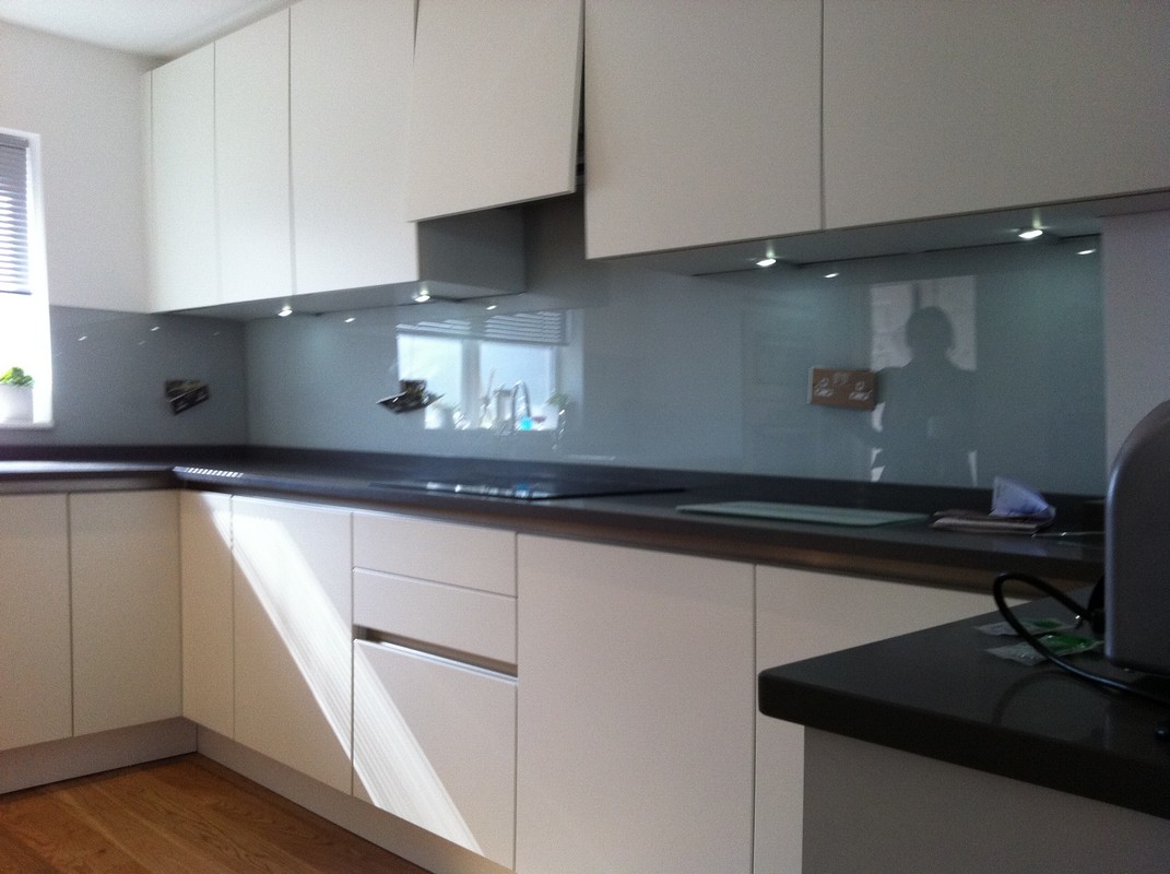 Grey glass kitchen splashback with LED lighting in Teddington